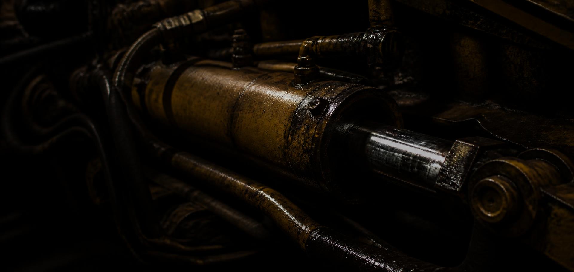 Hydraulic cylinder and pipework on heavy equipment